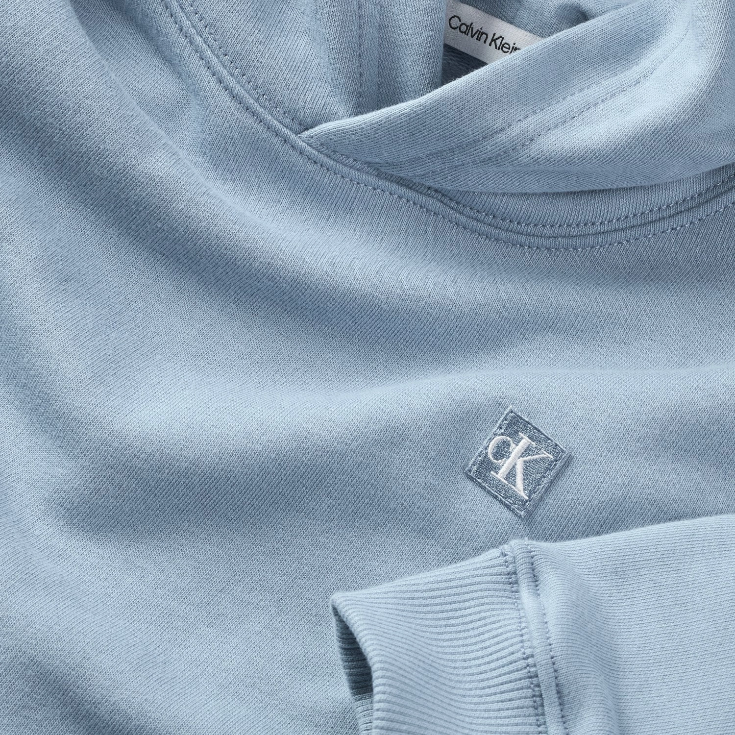 Urban Outfit Calvin Klein Faded Denim Monogram Mini Badge Hoodie