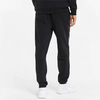 Versatile Look Puma pantalone in felpa con banda laterale e polsino al fondo ESS  Tape Sweatpants FL cl 849042 01 black